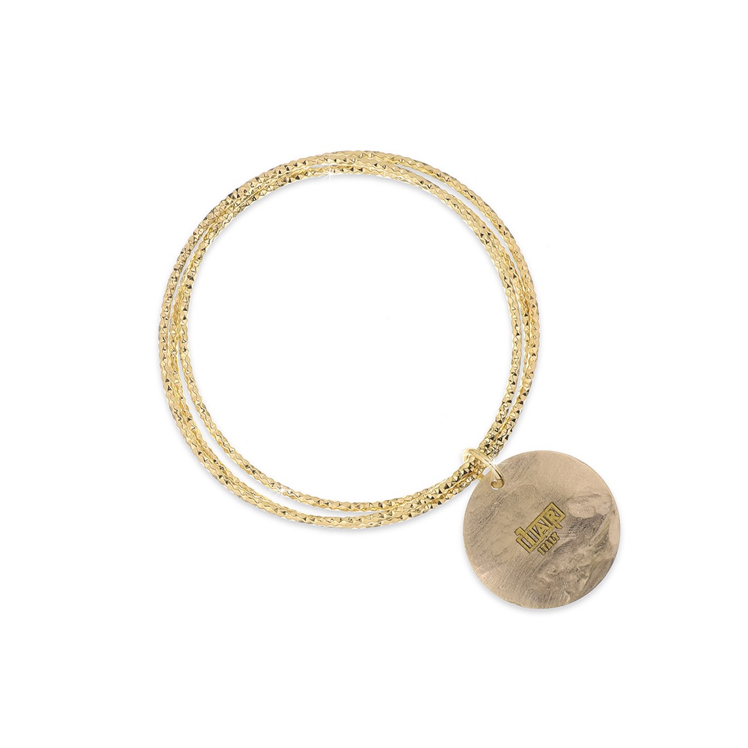 Scopri l'eleganza senza tempo del Bracciale Rigido UnoAerre, un gioiello di lusso che incarna la raffinatezza dell'alta gioielleria.