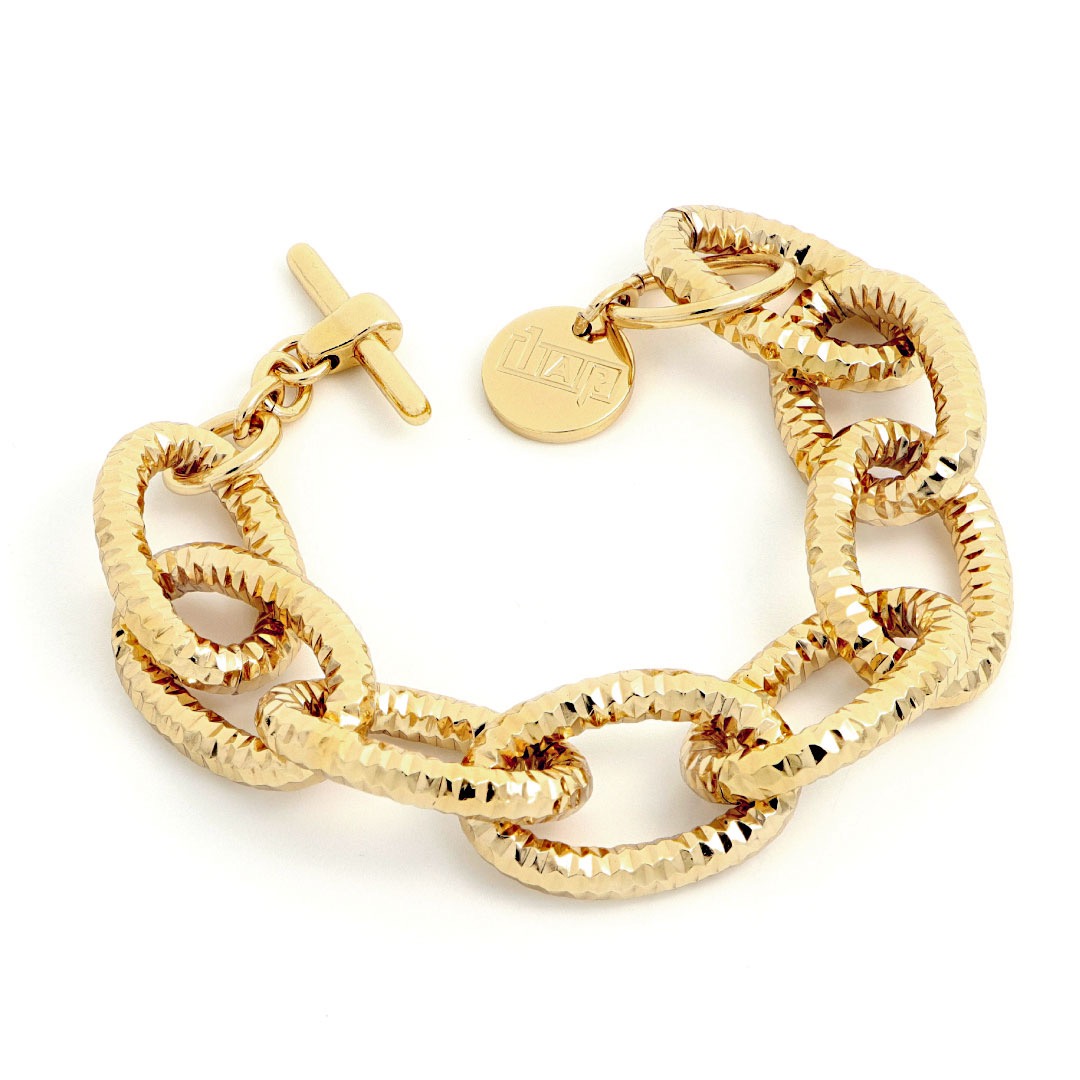 Bracciale UnoAerre dorato: un gioiello di lusso per un'eleganza senza tempo.