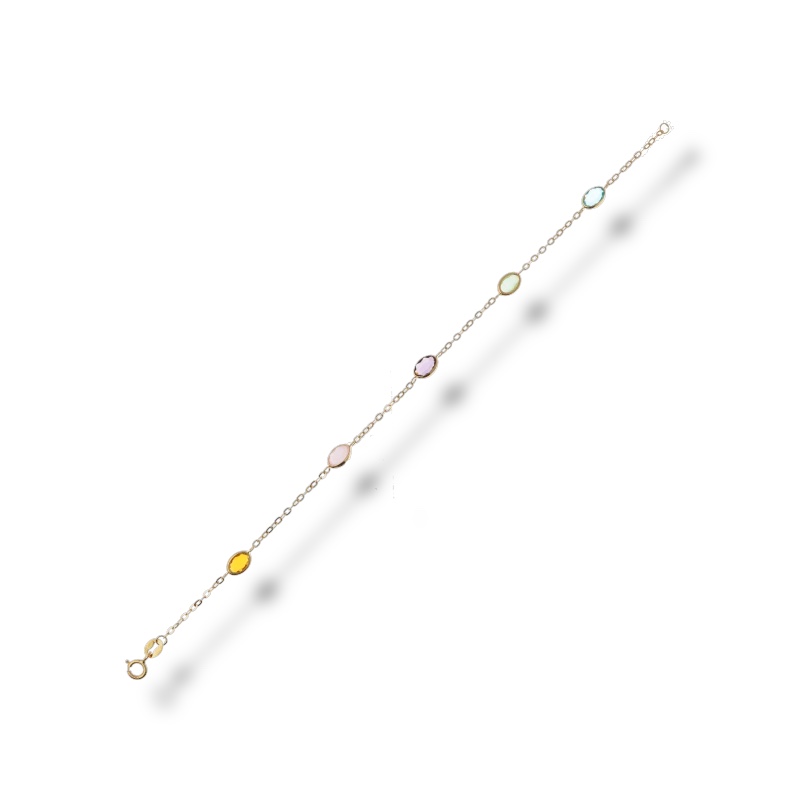Bracciale da donna in oro con pietre preziose, un gioiello di lusso perfetto per un'occasione speciale.