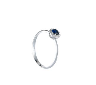 Splendido anello in oro 18k con zircone blu, un gioiello di lusso perfetto per un'occasione speciale.