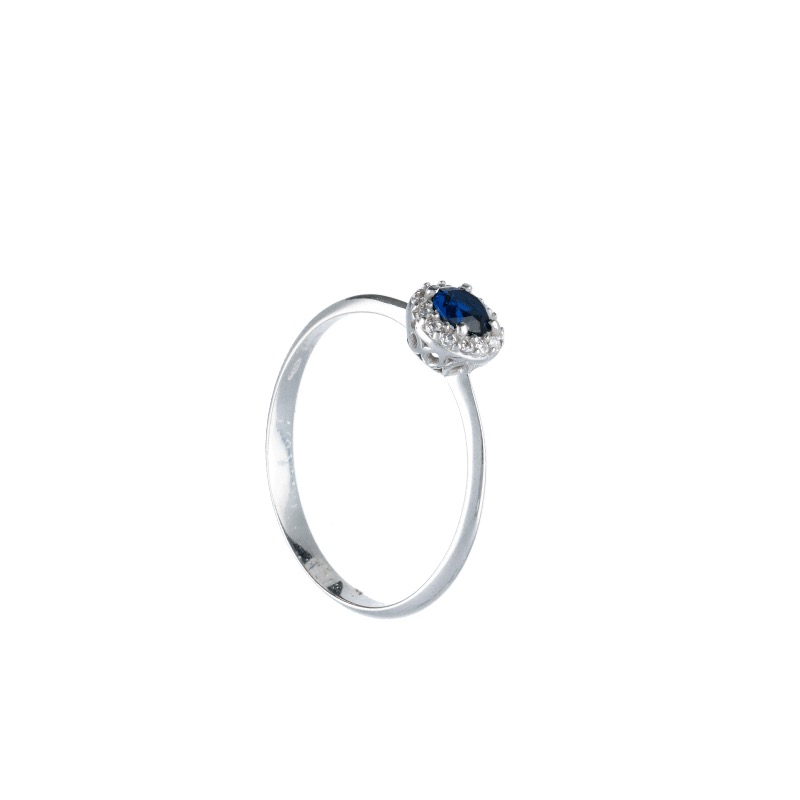 Splendido anello in oro 18k con zircone blu, un gioiello di lusso perfetto per un'occasione speciale.